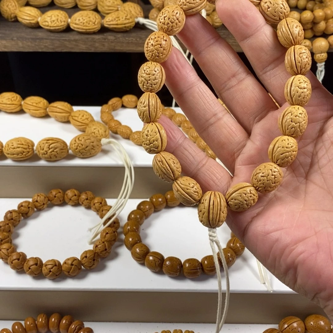 可***乐桃核吊坠沈阳钱袋子原皮手持