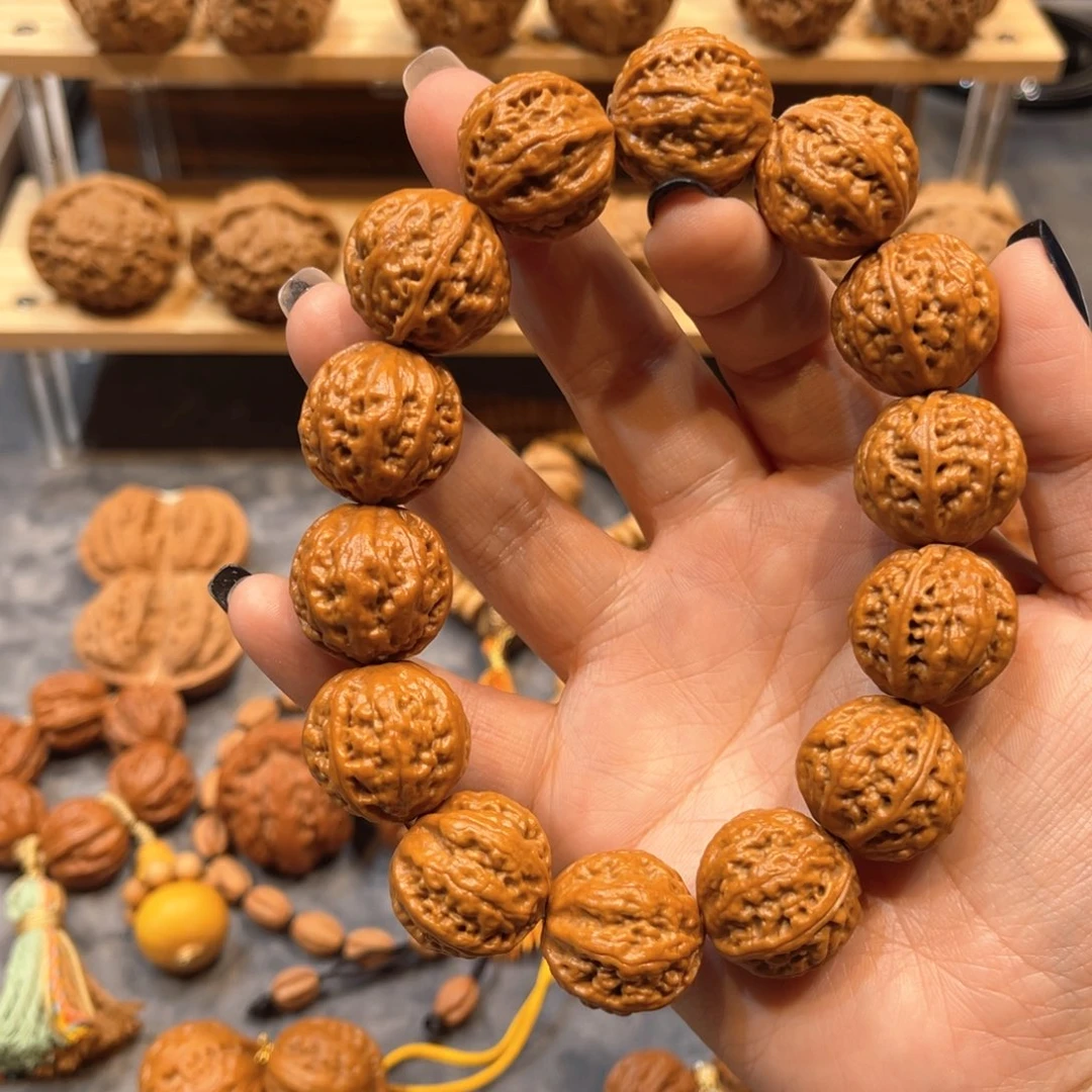 照***爹桃核把件霸王龙手串