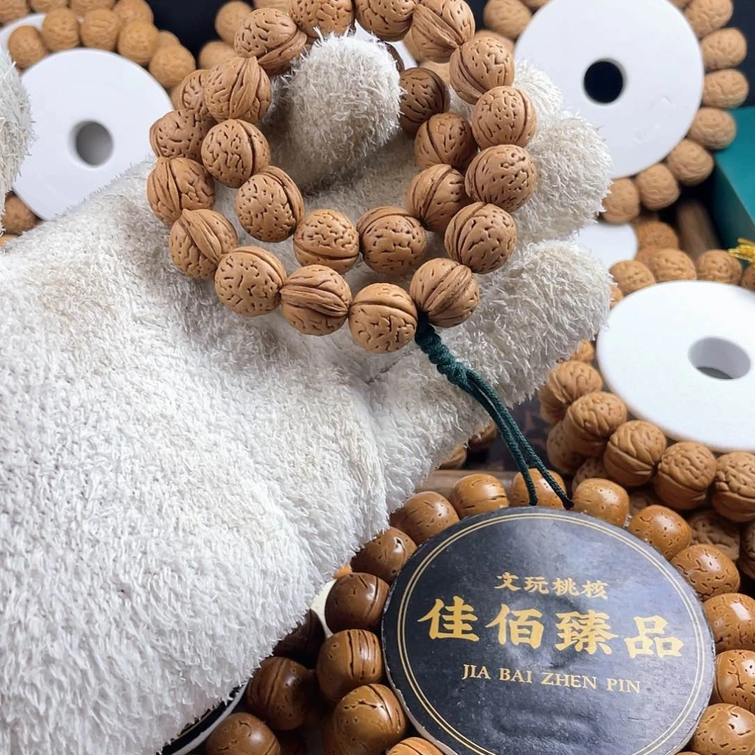 吊坠桃核野生小金豆手持