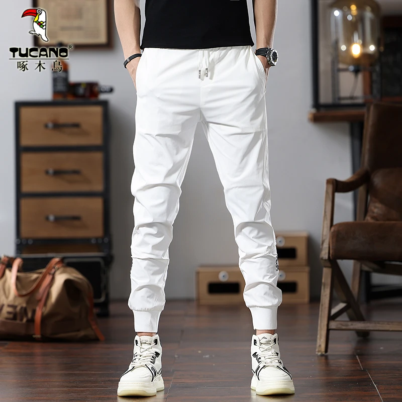 啄木鸟白色裤子男士休闲裤夏季薄款冰丝速干弹力运动裤男裤九分裤
