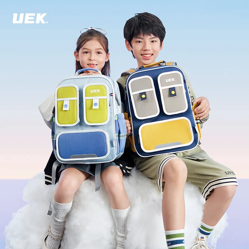 UEK小学生时尚透气防水超轻潮流韩版英伦减压双肩书包双肩背男孩