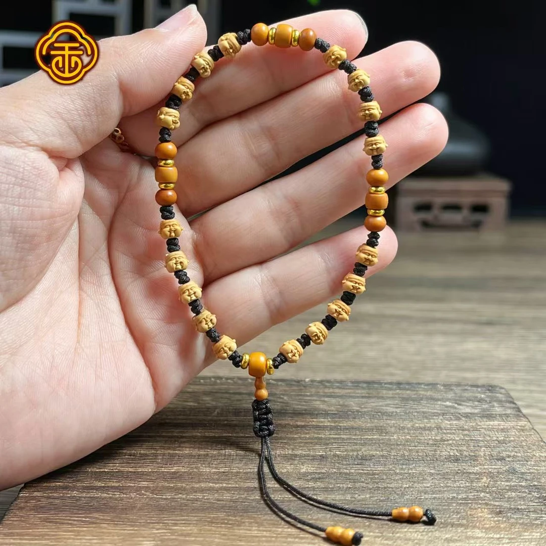 A 橄榄核尖 0.6小财神 文玩手串 A