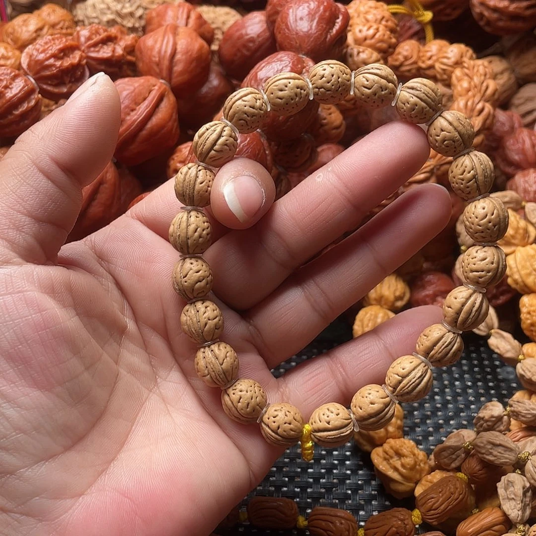****呀文玩核桃手串桃核