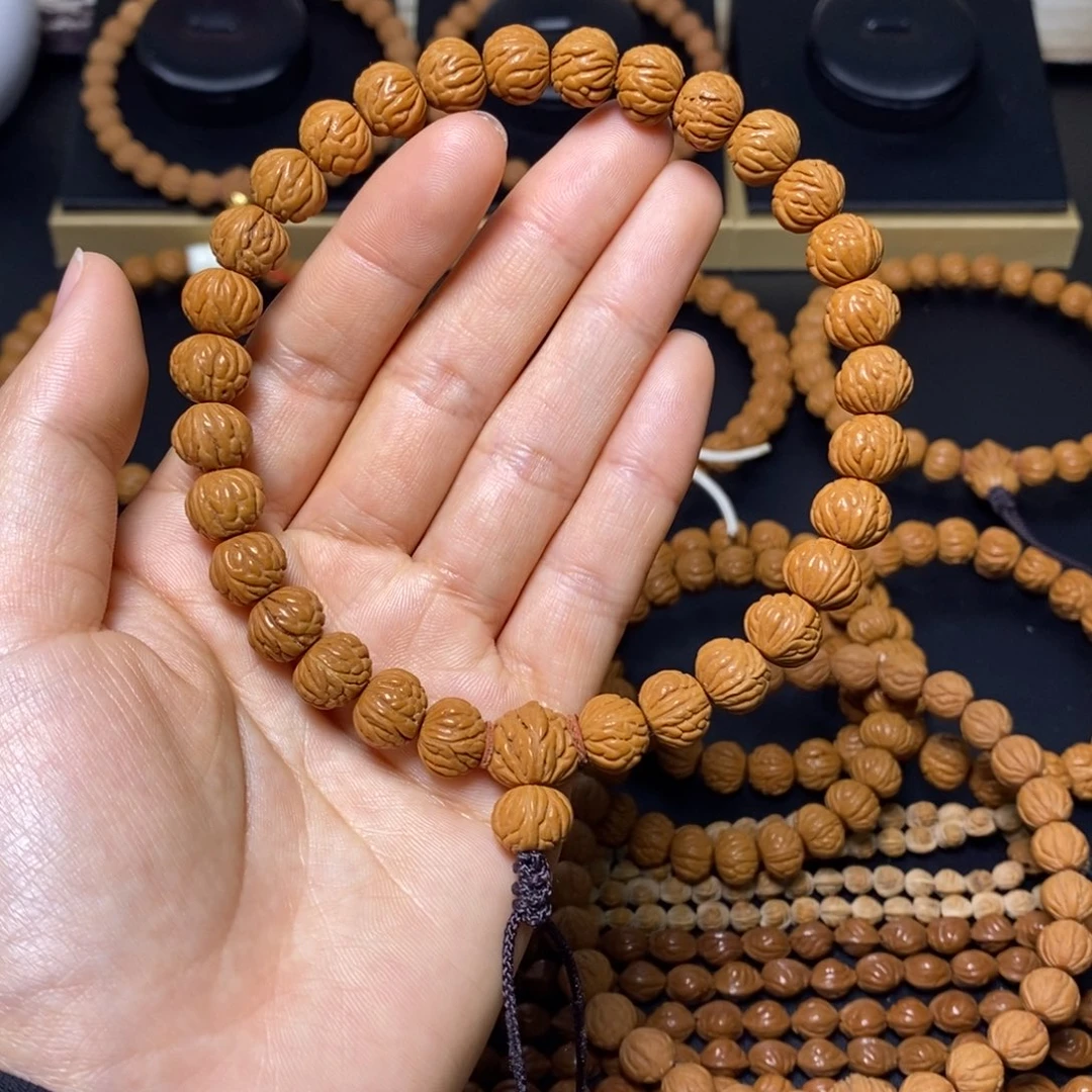 萝***丁桃核手串秦岭文玩桃核手持