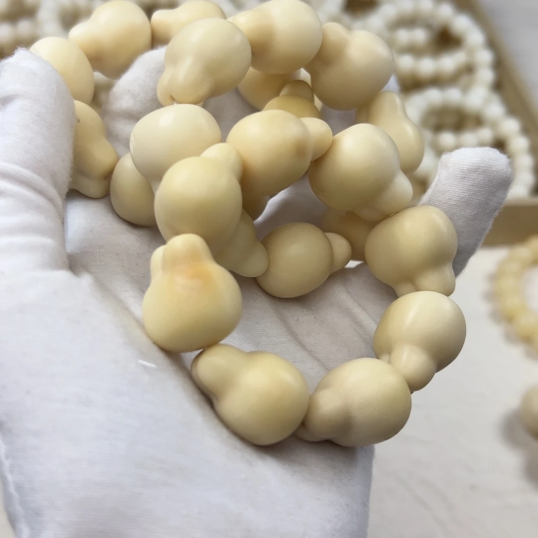 菩提根/象牙果吊坠奶黄8颗兔牙手捻