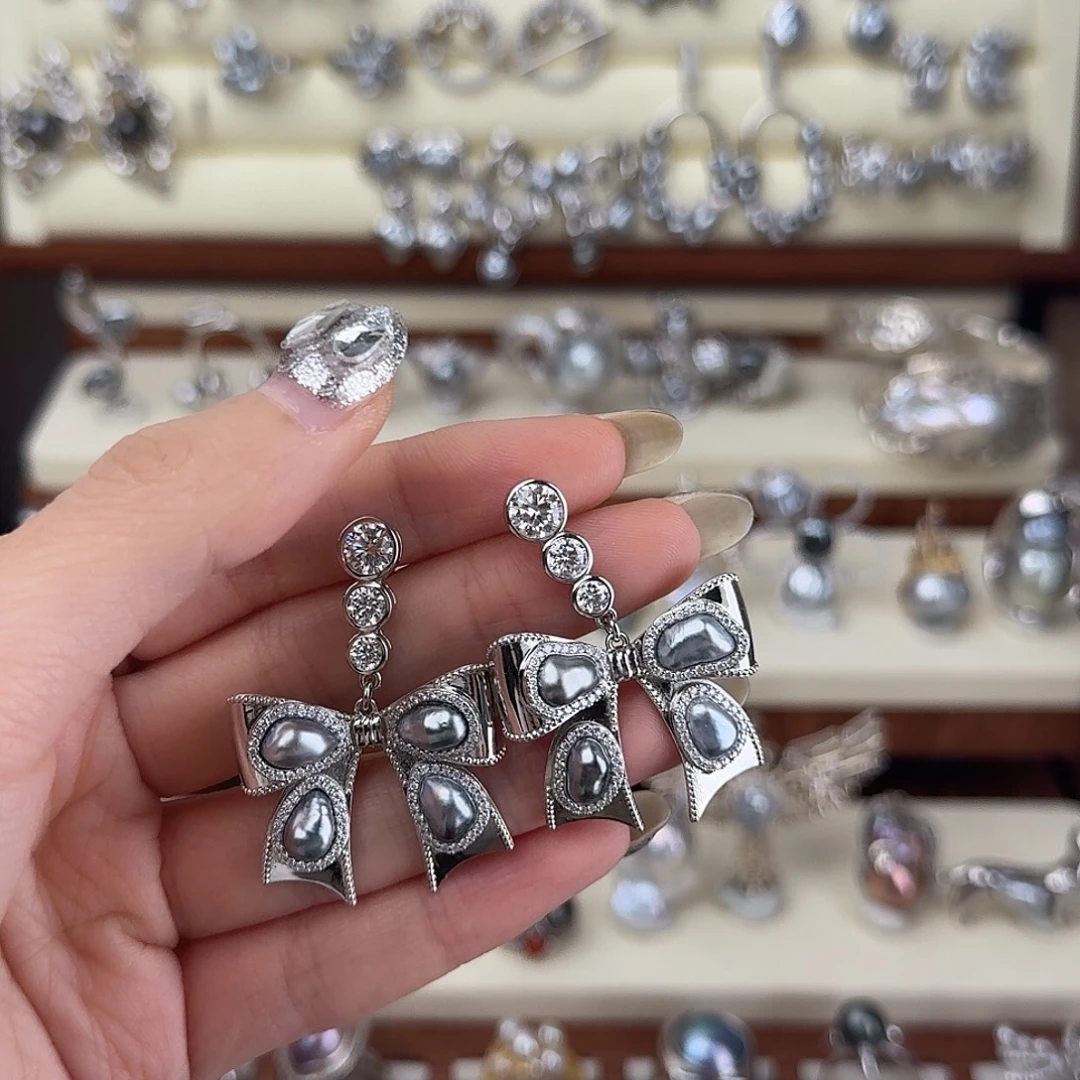 芙***宝非金属925银蝴蝶结耳钉S925银