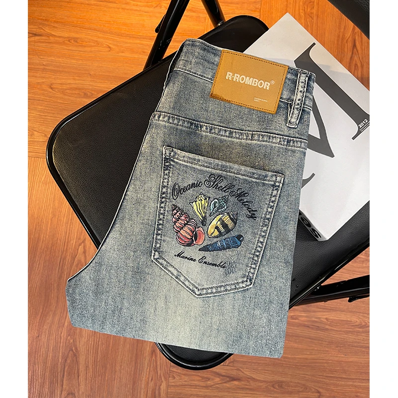 高级感个性印花潮牌九分牛仔裤男夏季薄款潮流破洞补丁修身小脚裤