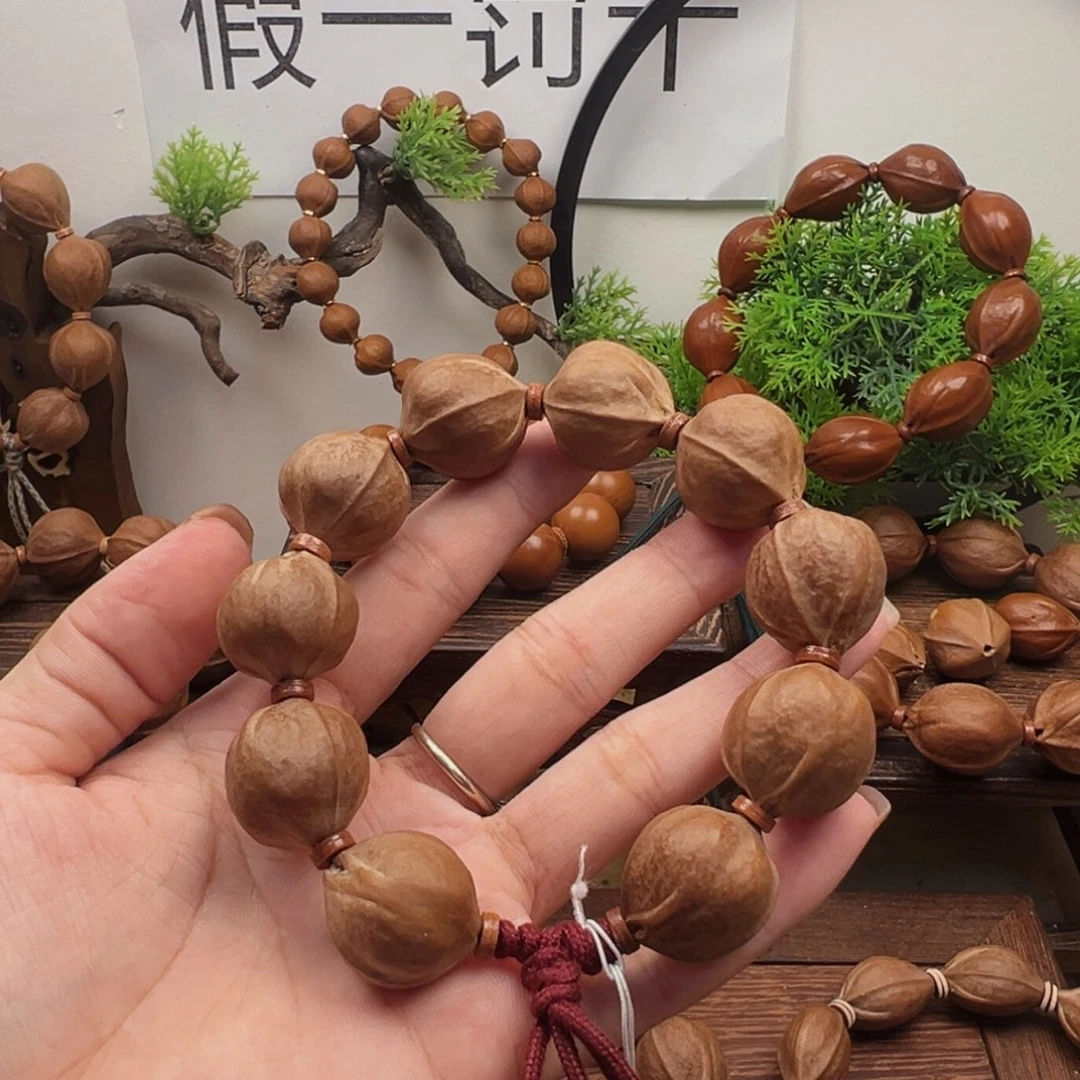 t***n橄榄核手串20.22梅林铁核