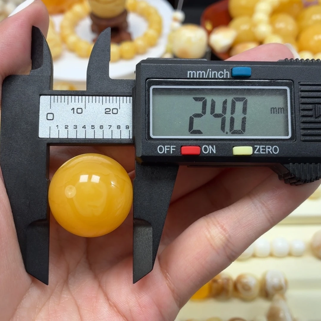怦***Z琥珀未镶嵌珠宝奇石焦皮鸡油黄眼睛圆珠24mm
