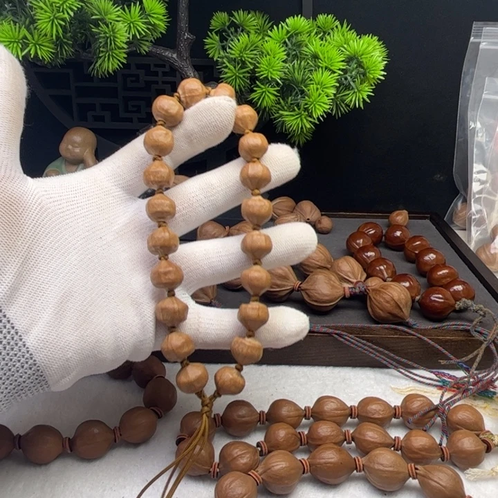 旋***.橄榄核其他1.2*1.1原皮三花蒜头铁核20颗