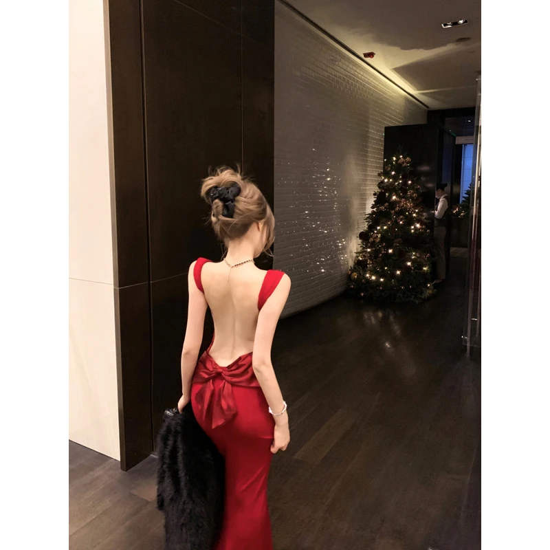 韩系轻奢缎面蝴蝶结露背长裙女冬修身显瘦包臀吊带礼服连衣裙