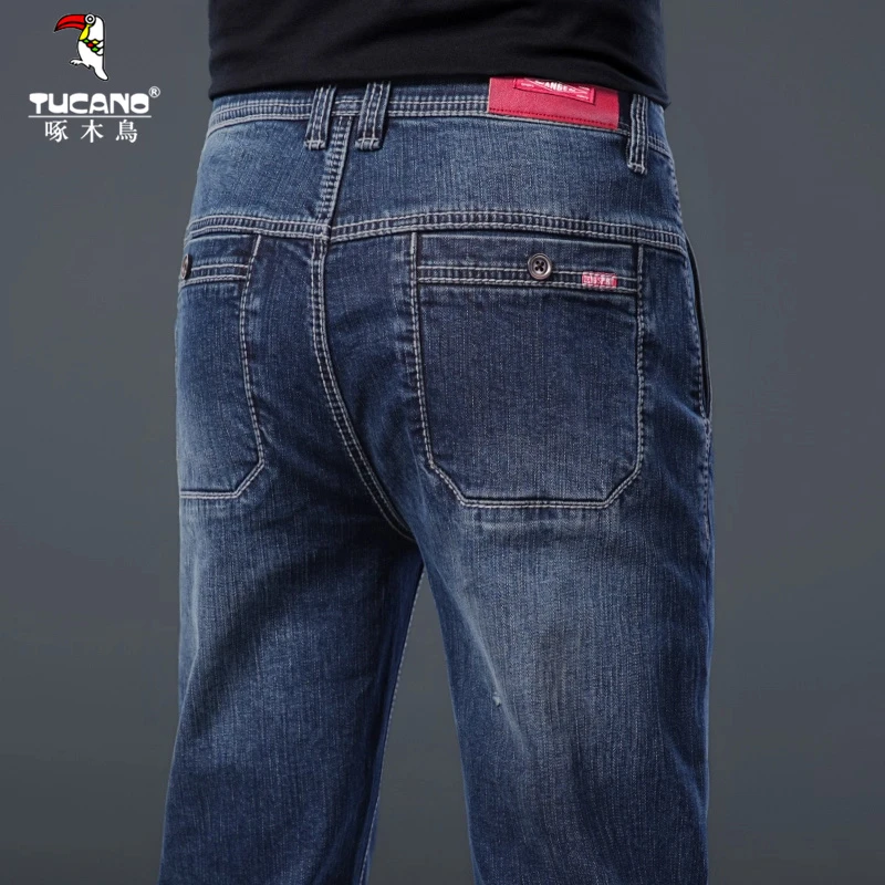 啄木鸟高端纯棉蓝色男士牛仔裤宽松直筒2025春秋简约大气舒适百搭