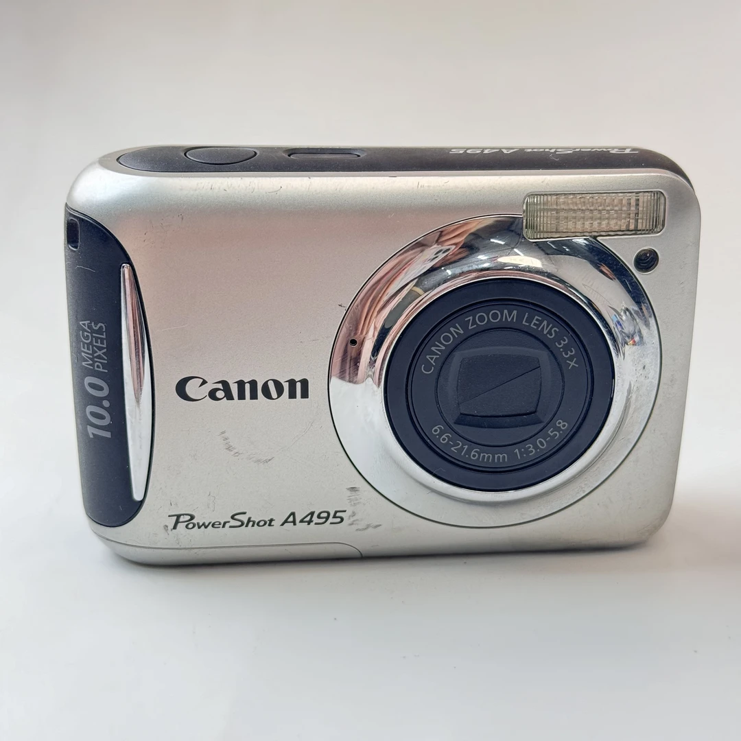 9新 Canon/佳能 a495自备五号电池1000w像素3x光变ccd数码相机