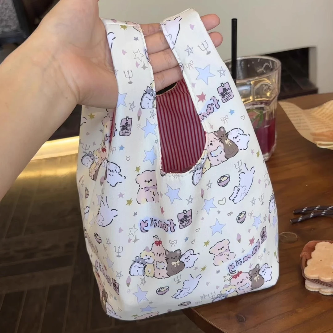 少女心小狗手腕包收纳袋新款上班族通勤便携手拎便当包可爱饭盒袋