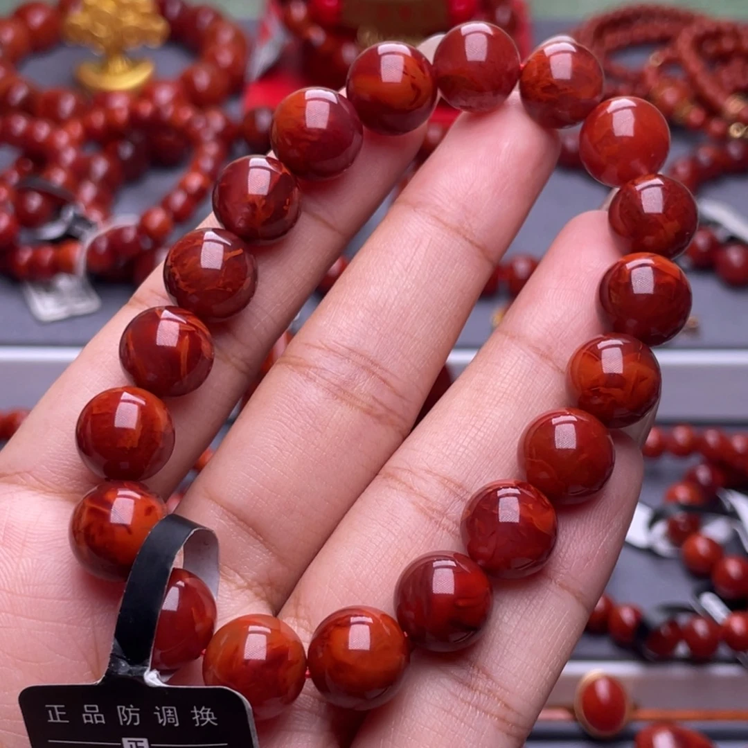 沐***惠南红玛瑙未镶嵌其他原矿）收藏级11mm瓦西牛血爆妖火焰单圈