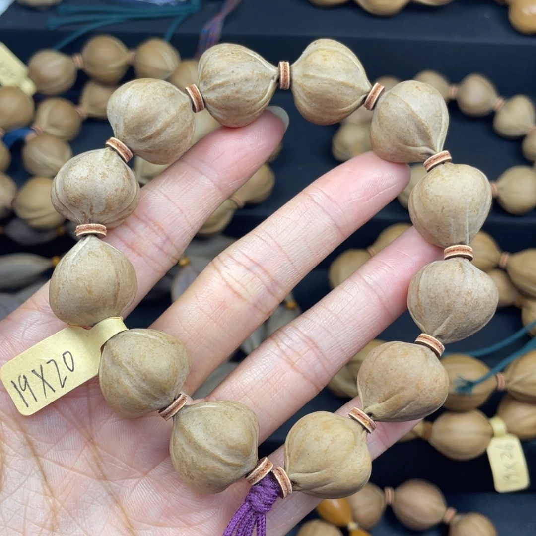 刘***）001橄榄核三花19*20