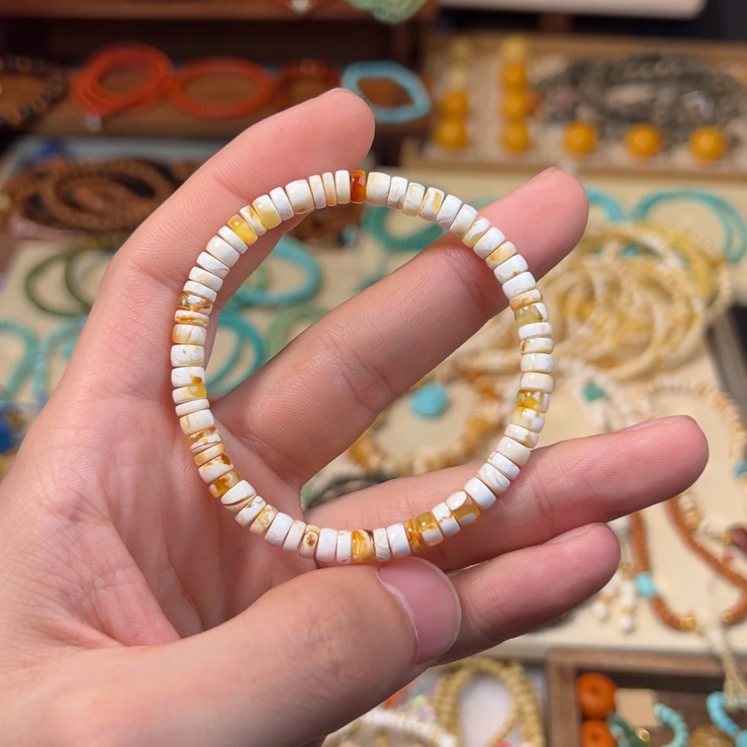 阿***喵蜜蜡未镶嵌手串金瓷白妖花溶洞药片毕业款