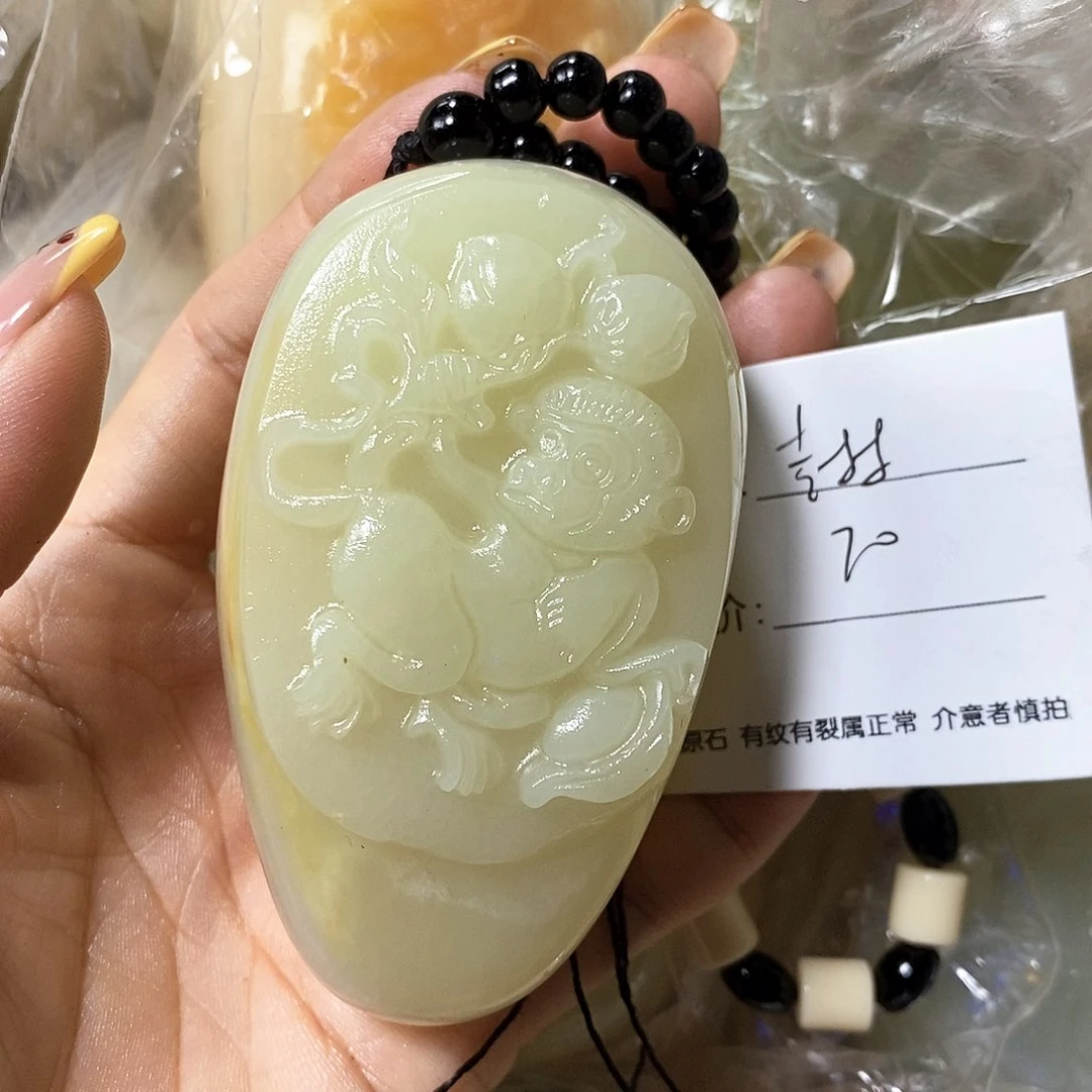 石材尘**梦古青石手把件
