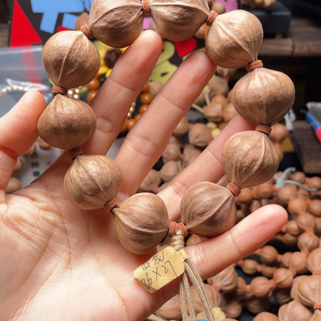 聚***泉吊坠橄榄核2627四花铁核