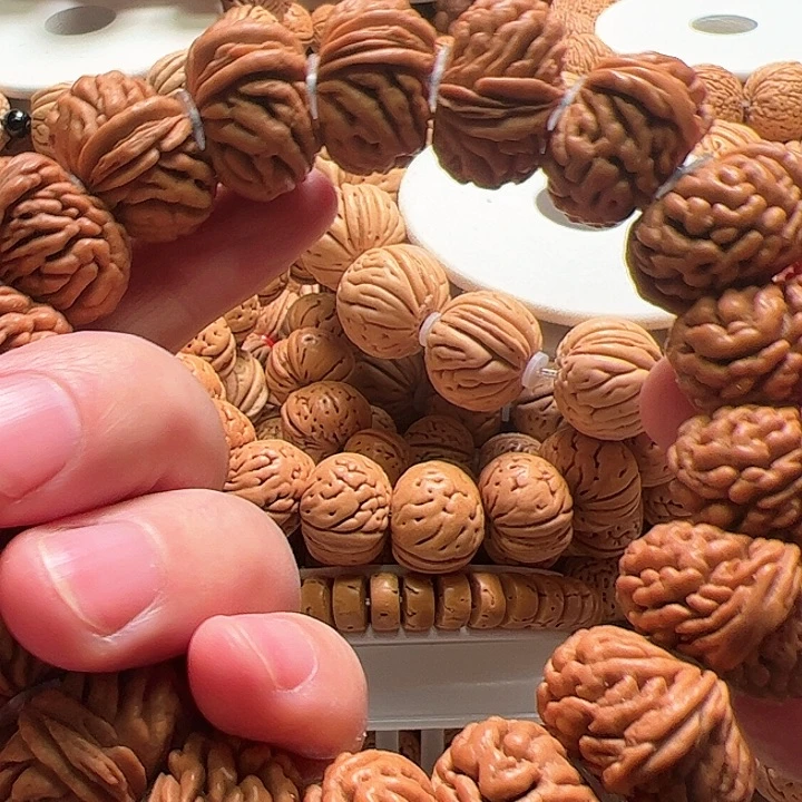 桃核手串南**?刺龙夹板桃核手串25尺