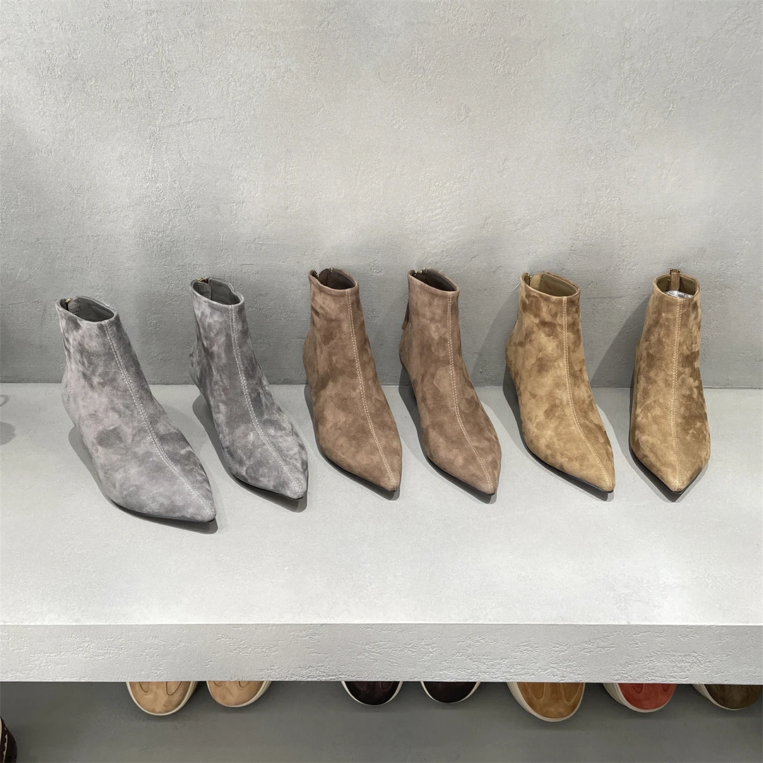 XFMD欧洲站2025冬款真皮女鞋时尚百搭羊猄皮加绒尖头细高跟短靴