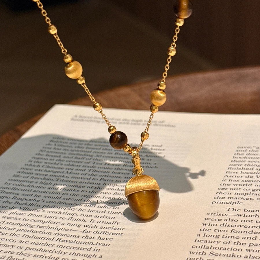 铜合金项链 秋冬拉丝虎眼石松果项链女轻奢小众高级感毛衣链配饰