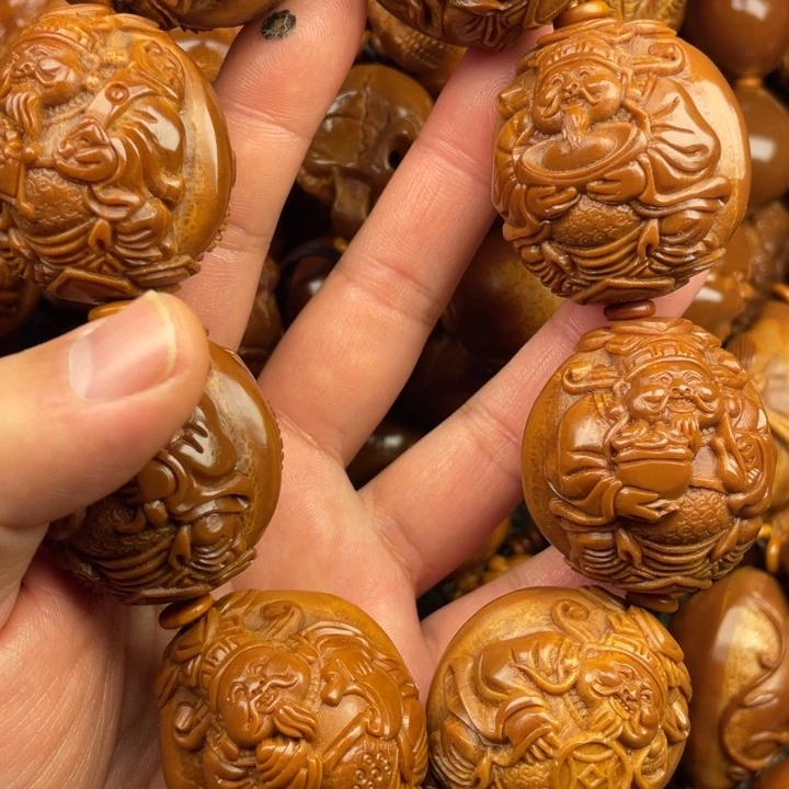 橄榄核吊坠小**材橄榄核手持