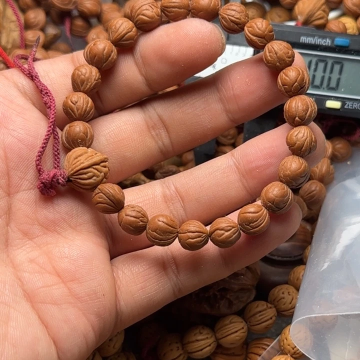 药*野生龙纹桃核手持一条