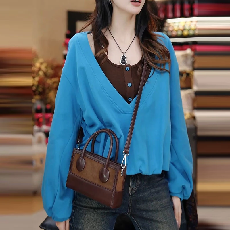 高级感小众拼色假两件卫衣女2025秋新款休闲时尚显瘦百搭通勤上衣