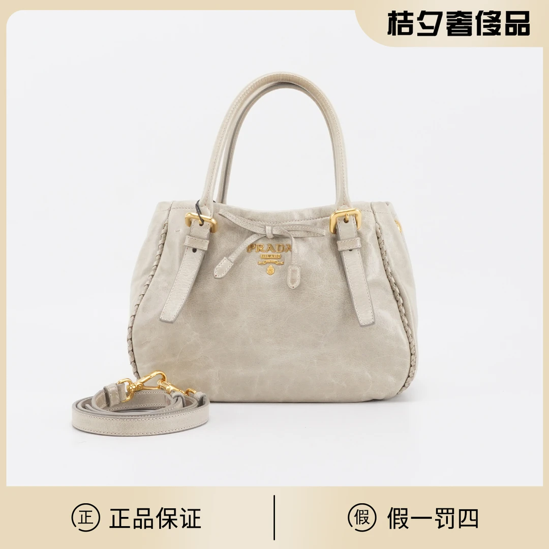 95新 Prada/普拉达 【静文】蝴蝶结油蜡皮手提斜挎包/BGD401400077
