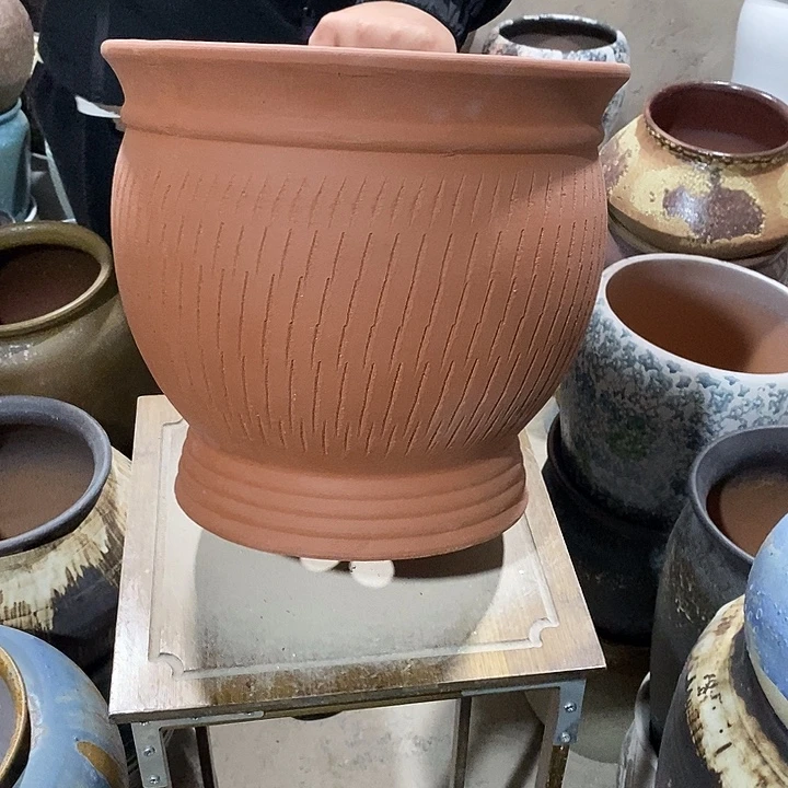 口30高度29红陶…………