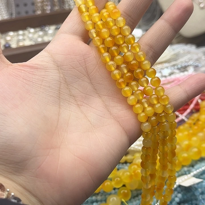 玛瑙/玉髓未镶嵌珠宝半成品一条6mm左右黄飘花