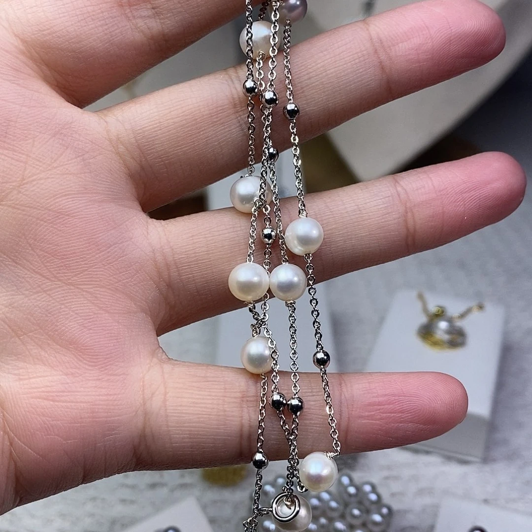 淡水珍珠银S925镶嵌耳饰