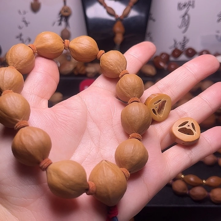 钱***生手串橄榄核梅林核正圆18.21