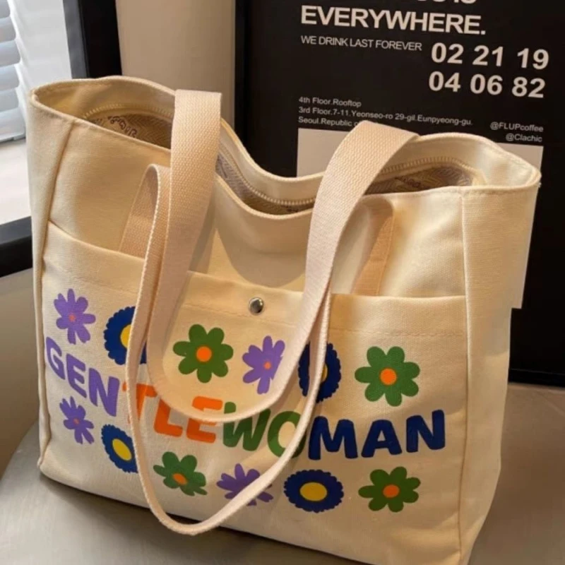 帆布包包女2025新款大容量通勤简约手提袋学生百搭装书单肩托特包