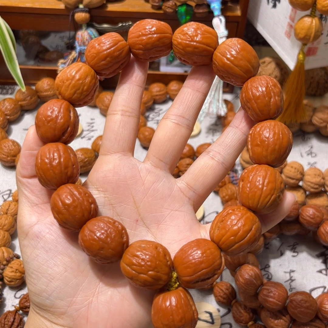 黎***麦桃核吊坠溏心光头