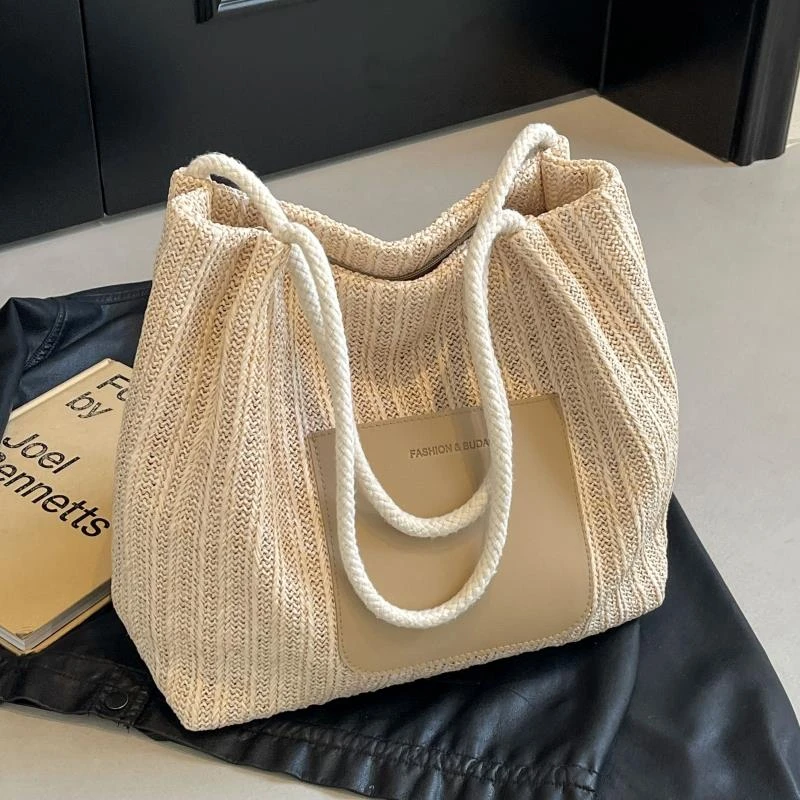 编织沙滩水桶包包女2025新款大容量通勤托特包海边度假单肩草编包