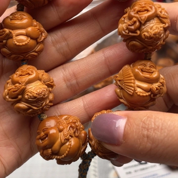 橄榄核手串吉**照雕刻艺术