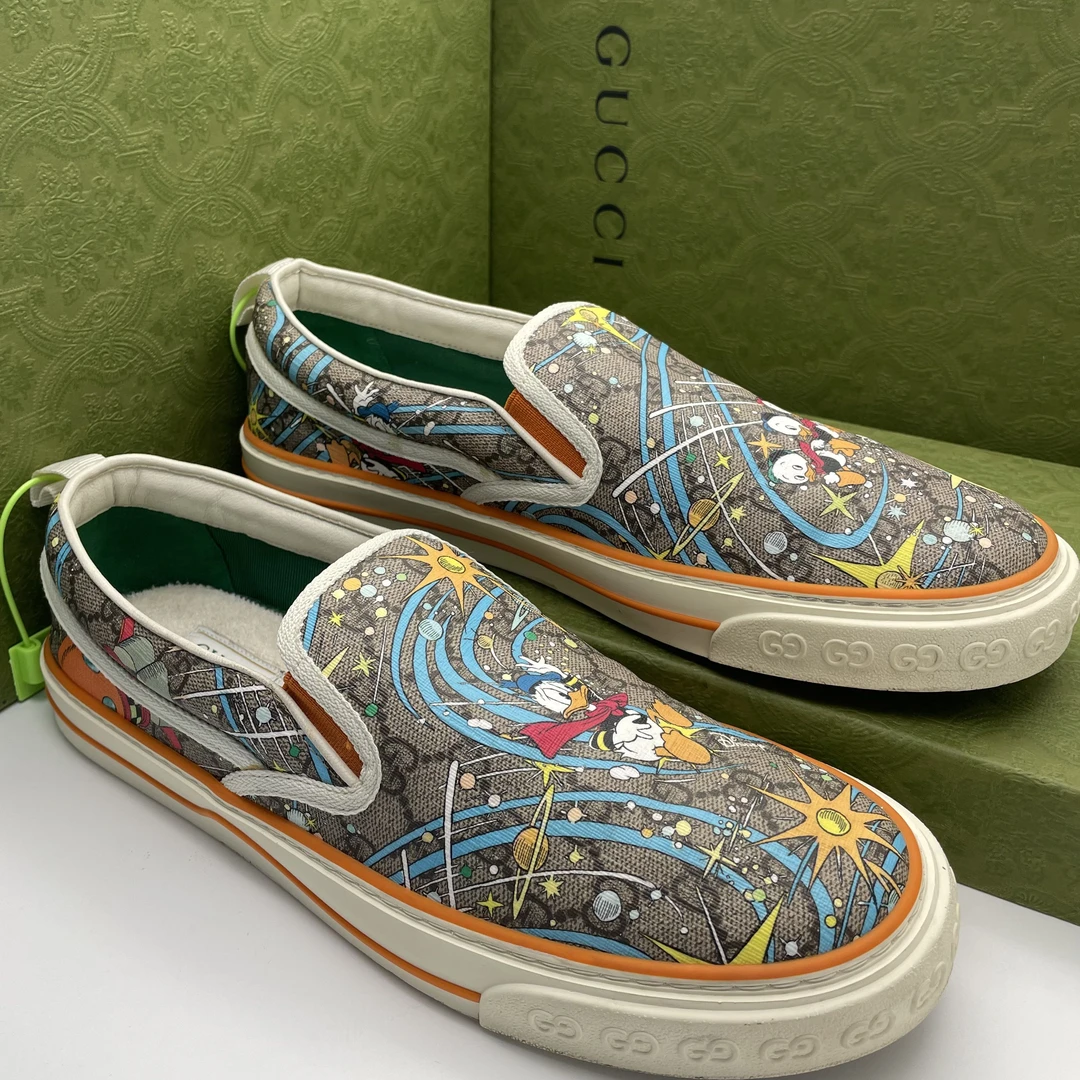 95新 GUCCI/古驰 44码/棕色老花双G唐老鸭印花休闲时尚一脚蹬鞋