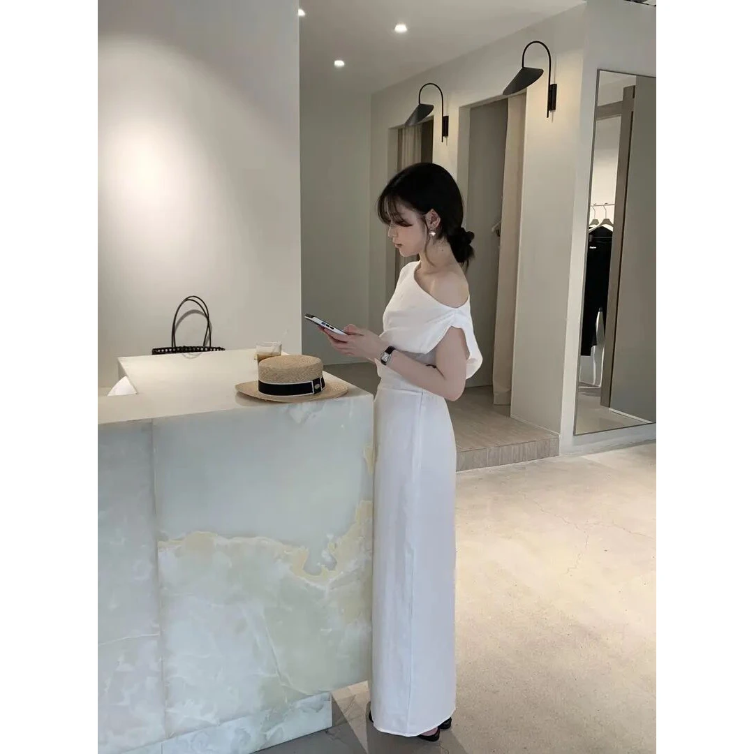 多巴胺夏季衣服气质亚麻斜肩连衣裙极简风设计感度假露肩长裙子女