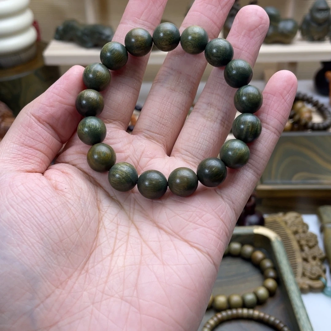 L***Y木绿檀木料手把件