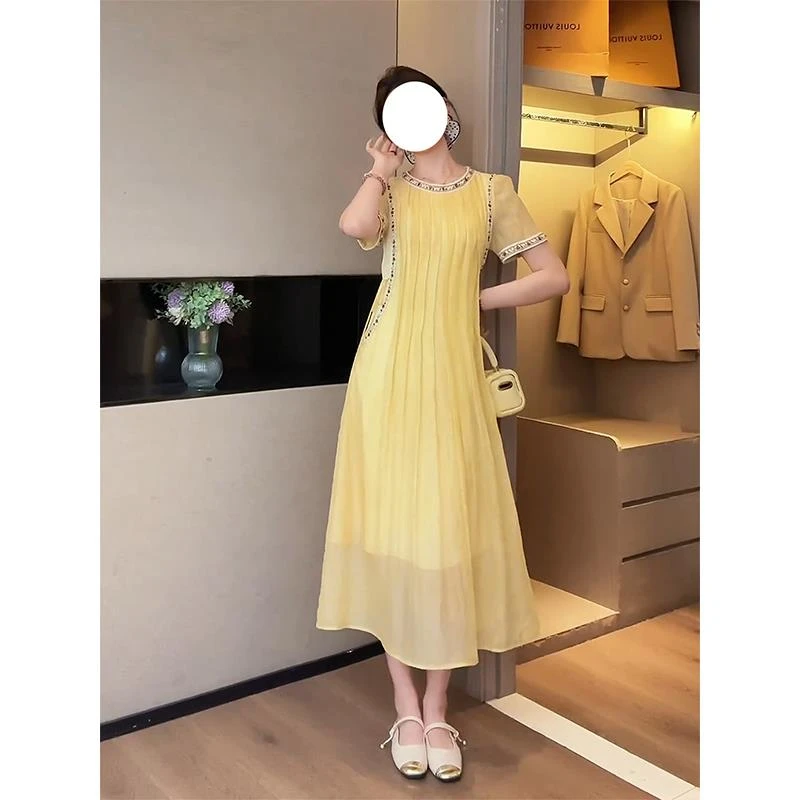海边度假气质优雅黄色连衣裙女2025夏季新款宽松休闲绝美长裙子潮