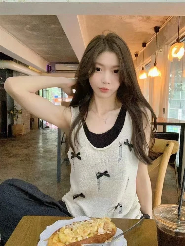 柒月水～ 蝴蝶结假两件针织无袖吊带背心镂空破洞小众设计感上衣女