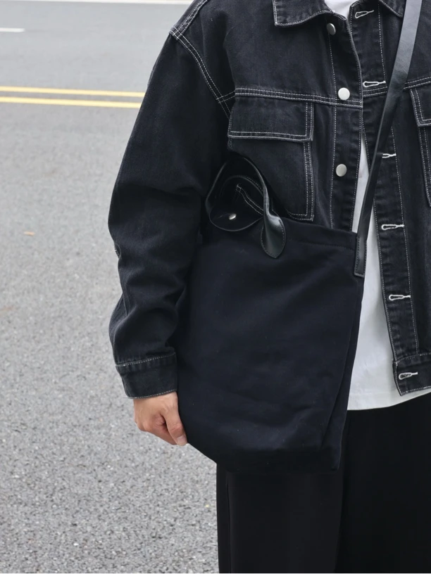 左千户真皮高级感手提斜挎包公文包大容量帆布包2025新款男通勤包