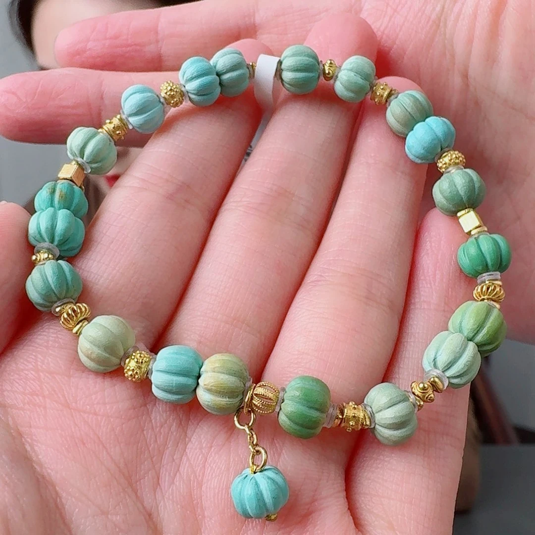 岚***耶绿松石18K金镶嵌珠宝奇石