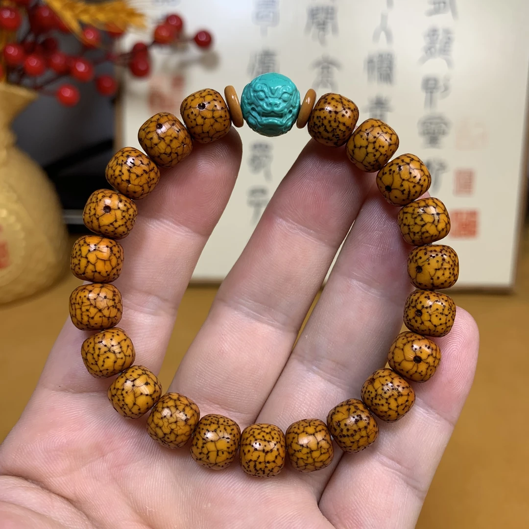 正宗海南星月菩提子老手串藏区回流开片纹桶珠配饰玉化包浆鸡油黄