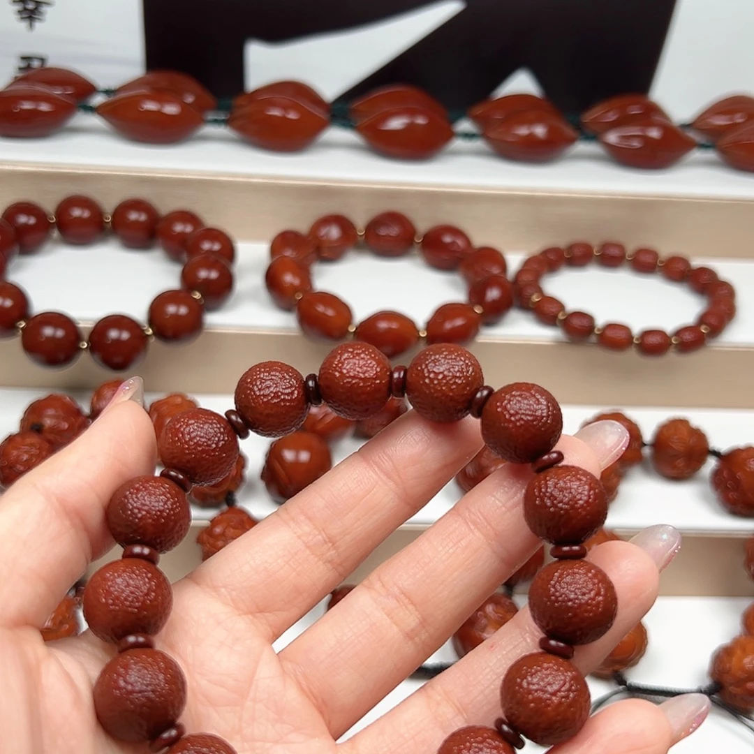 隧***远手串橄榄核橘皮手串