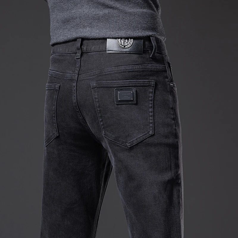 香港2025秋冬季牛仔裤男士修身直筒弹力百搭高端商务休闲黑色长裤