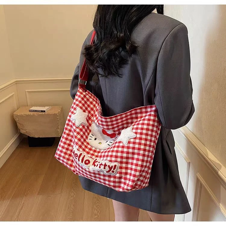 可爱HelloKitty格子单肩包女卡通大容量斜挎帆布包学生上课通勤包