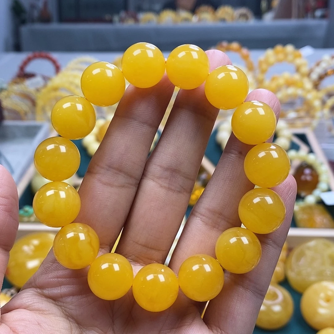 琥珀未镶嵌珠宝奇石14鸡油红圆珠24.06